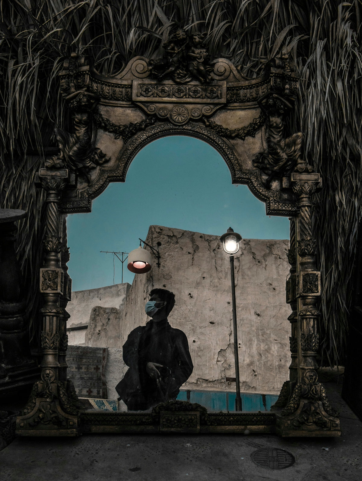 a man sitting on a bench in front of a mirror