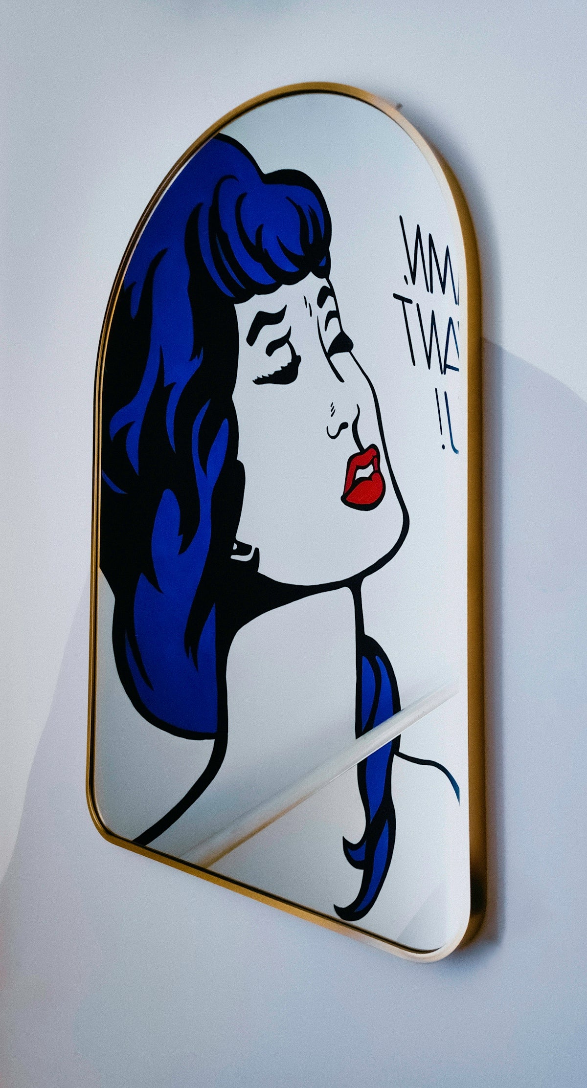 a picture of a woman's face on a mirror