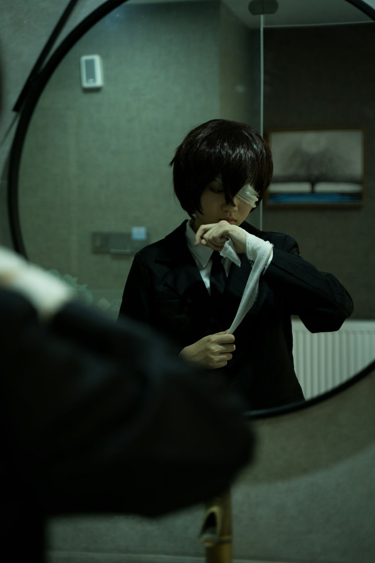 a man in a suit is looking in a mirror