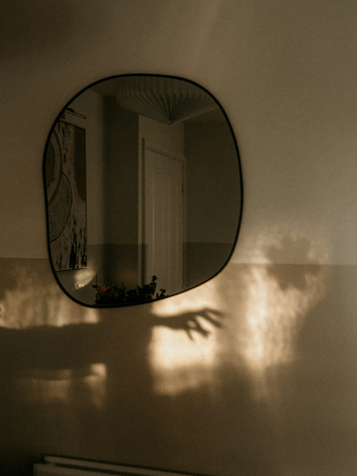 A bathroom with a mirror and a radiator