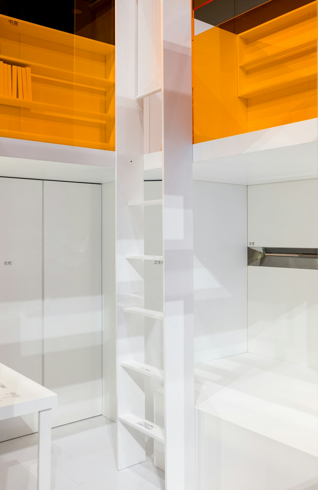 Modern white interior with orange shelving units and shelves