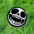 Gorillaz mascot, Bonesy, depicted as a skull symbol: Round Frameless Manga Silhouette, Gamer Room Decor - LiquidMirror