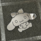 Bunny-shaped acrylic mirror displayed outdoors with potted plants